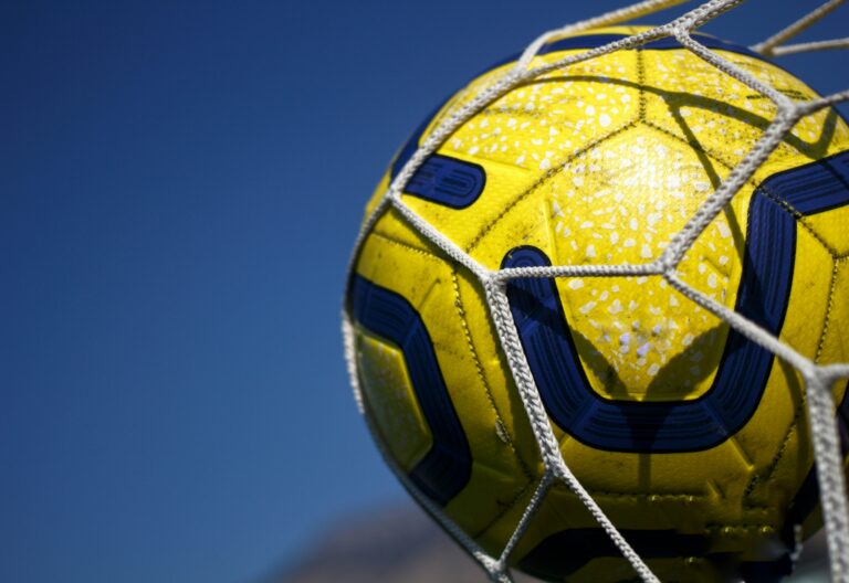 soccer ball in a soccer net